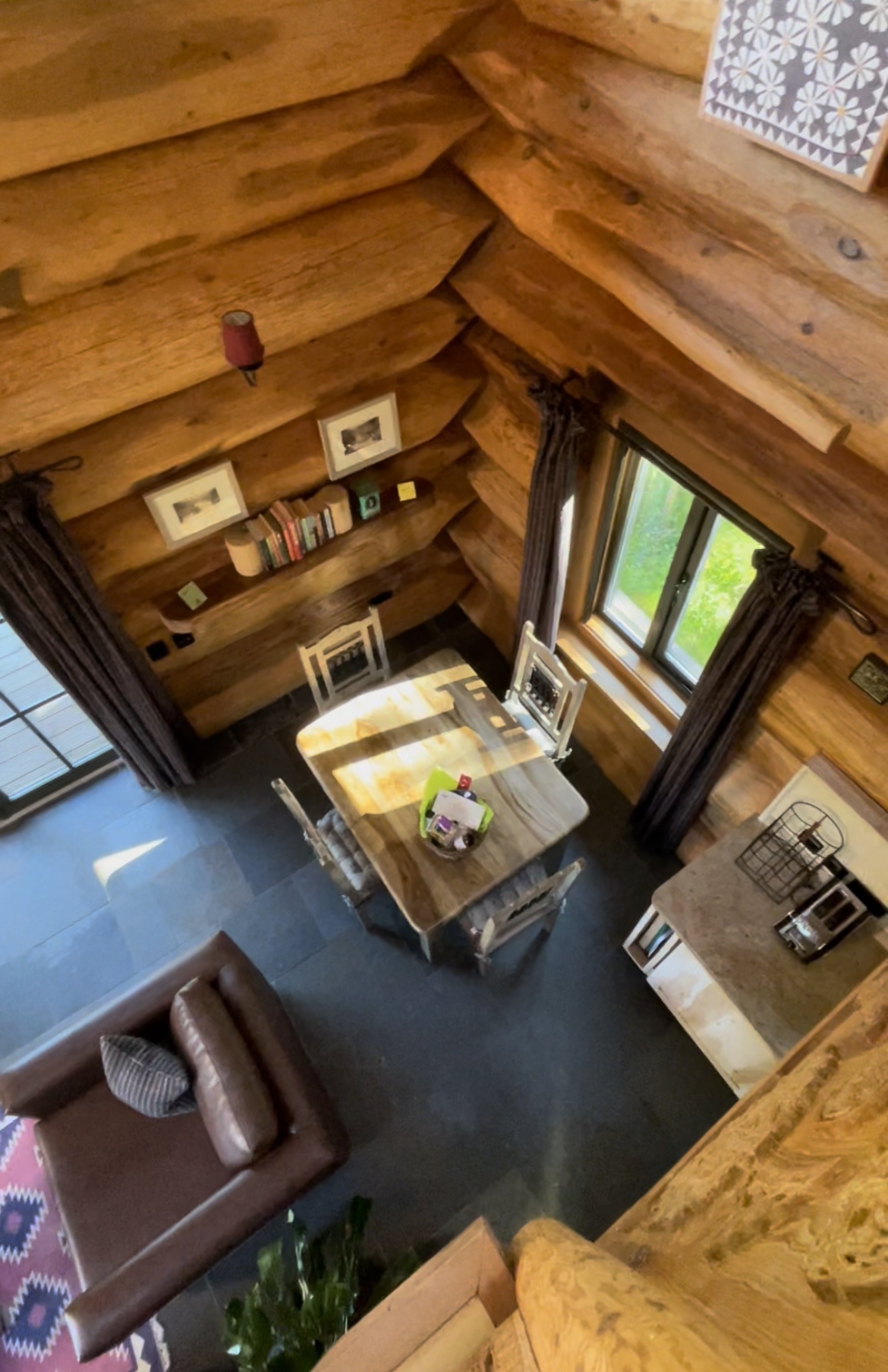 Looking down to the the main living room on the ground floor from the loft